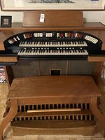 Front view of Conn organ, bench and pedalboard