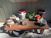 Full view of bench and assorted pots and accessories
