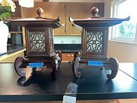 Front view of both wooden pagoda lamps