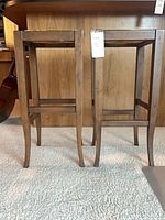 pair of wooden bar stools side view