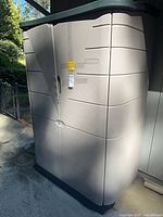 Full view of Rubbermaid vertical shed outdoors