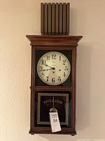 Full view of Ridgeway regulator wall clock hung on wall