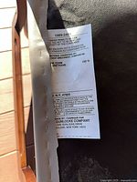 Underside tag on armchair showing Gunlocke label