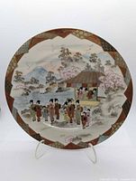 Full frontal view of hand-painted Japanese porcelain plate