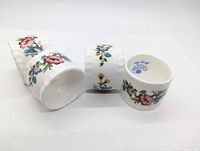 Four Coalport Ming Rose napkin rings front view showing floral design and one backstamp