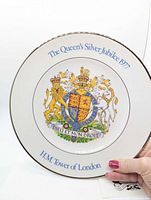 Front of plate showing coat of arms and inscriptions