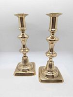 Front view of both brass candlesticks