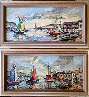 Front view of both framed harbour sailboat paintings