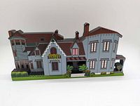 Front view of painted wooden Kingscote house silhouette