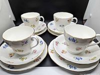 Full set arranged showing cups on saucers with plates underneath