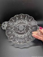 Full view of crystal Cornflower serving plate showing scalloped edges, floral cut pattern and both handles