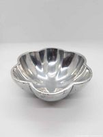 Angled view of cast aluminum flower-shaped bowl