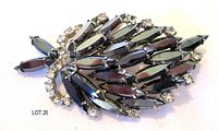Front view showing black marquise stones, clear rhinestone border and overall leaf shape