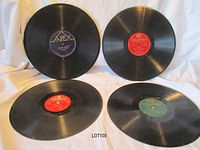 Group shot of four 10-inch 78 RPM records showing label colors and overall condition
