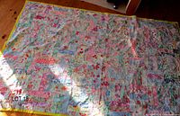 Full view of patchwork tied quilt on floor