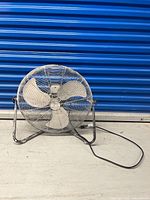 Full view of Commercial Electric floor fan on stand with power cord