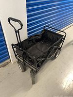 Side angle showing full wagon with handle extended and wheels