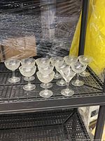 Shelf view of 12 stemmed glasses