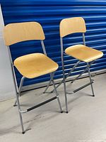 Front view of two IKEA Franklin folding bar stools