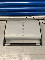 Closed grill showing full exterior and cord