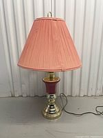 Front view showing full lamp with shade, base, cord