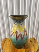 Front view of multicolour drip glaze ceramic vase
