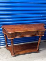 full view of wooden console table front and side