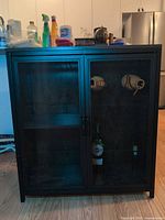 Front view closed showing mesh doors and top surface