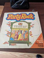 Front cover showing title, artwork, notes of 52 hits and 4-record set