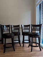 Front view of all four matching bar stools