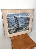 Full view of framed print on stand