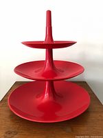 Front view of assembled red 3-tier Koziol Babell tray