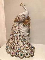 Full view of porcelain peacock figurine