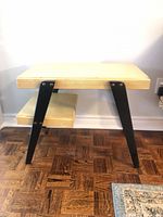 Front view of two-tier plywood side table showing top and shelf