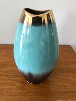 Front view of sea-foam green and gold-tone glazed West Germany vase