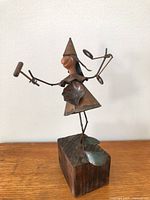 Front view of entire Allan Ryan copper & brass sculpture on wood base