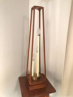 full view of obelisk lamp on table