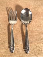 Front view of Wolfenden sterling silver baby fork and spoon