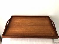 Top view of teak serving tray showing full rectangular shape and wood grain