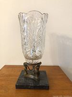 Full view of cut crystal table lamp on marble base