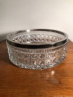 side view showing button and cane pattern and metal rim