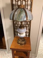Full view of lamp on table showing shade, body and base