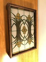 Overall view of Cutler painted glass tray standing on edge