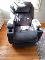 Front view of dark grey massage recliner chair