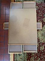 Top view showing puzzle table with all six drawers extended