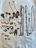 Overview of entire jewelry lot on fabric background