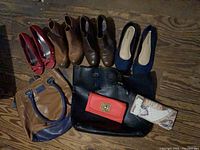 Five pairs of women’s shoes, two tote bags, red wallet, map-print clutch