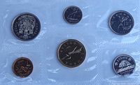 Reverse sides of six sealed coins showing 1991 Canadian designs