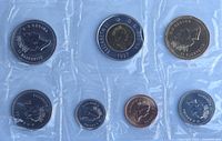 Obverse sides of seven 1997 Canadian coins sealed in plastic pouch