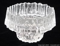 Side view showing melting ice texture and overall form